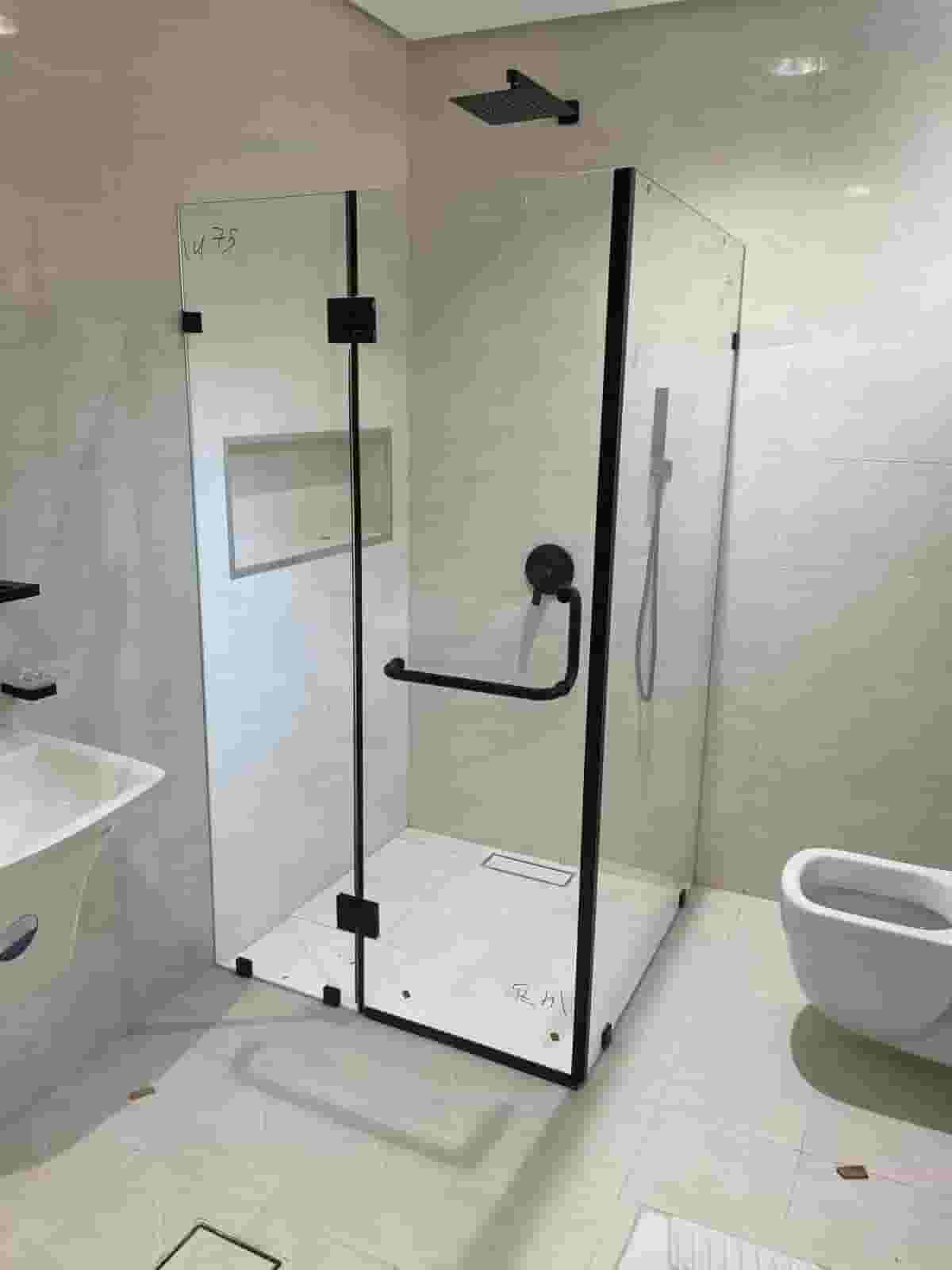 Glass technician installing mirror and secret glass Glass technician installing mirror and secret glass